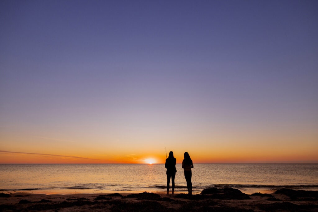 A couple, Fishing at Normanville beach, a quick walk from Echo holiday Parks - Normanville.